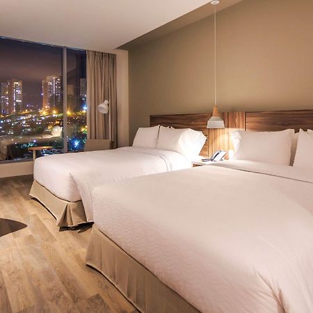 Novotel Medellin El Tesoro Exterior photo A room at the hotel