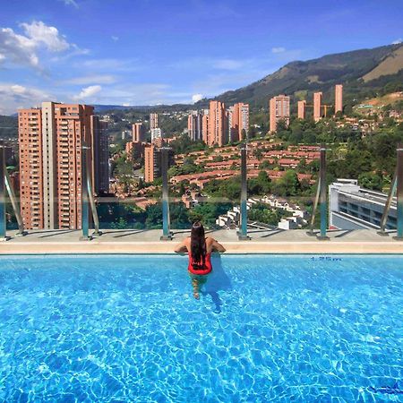 Novotel Medellin El Tesoro Exterior photo View of El Burgo from the swimming pool