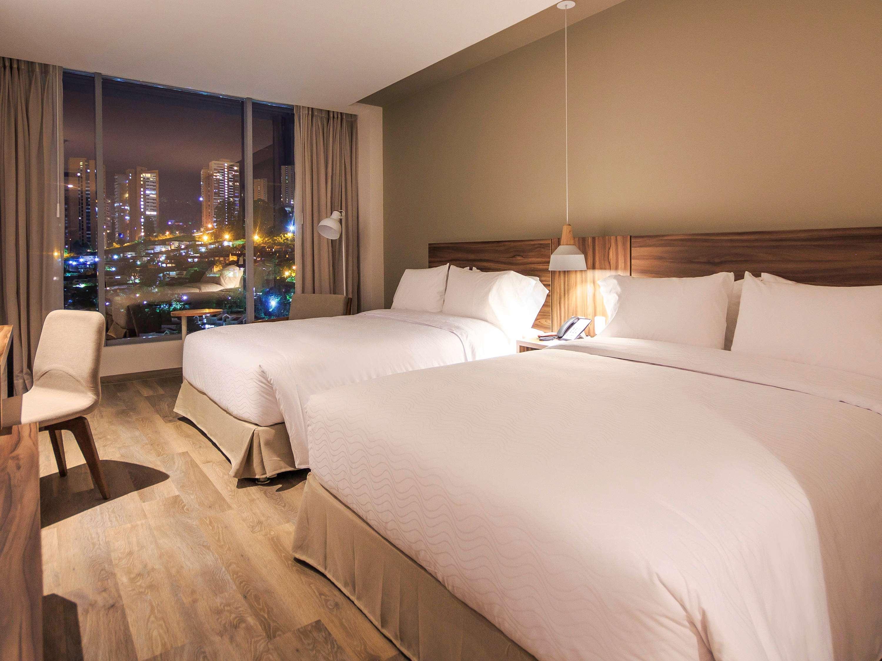 Novotel Medellin El Tesoro Exterior photo A room at the hotel